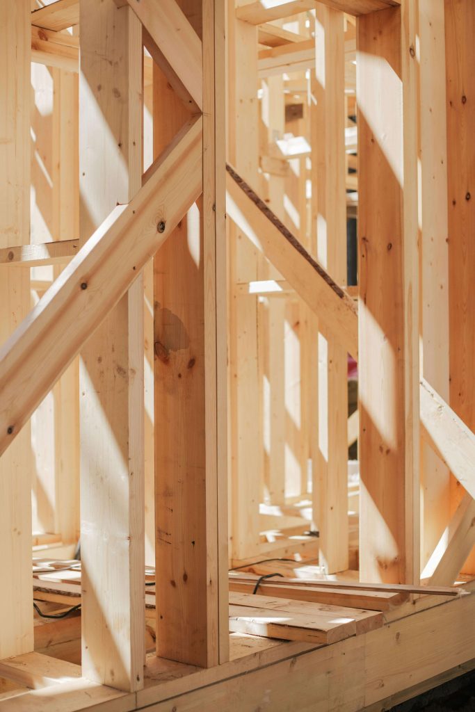 Close-up view of wooden framing inside a house under construction.